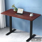 Modern wooden computer table with black metal legs, laptop, cup, and vase in home office