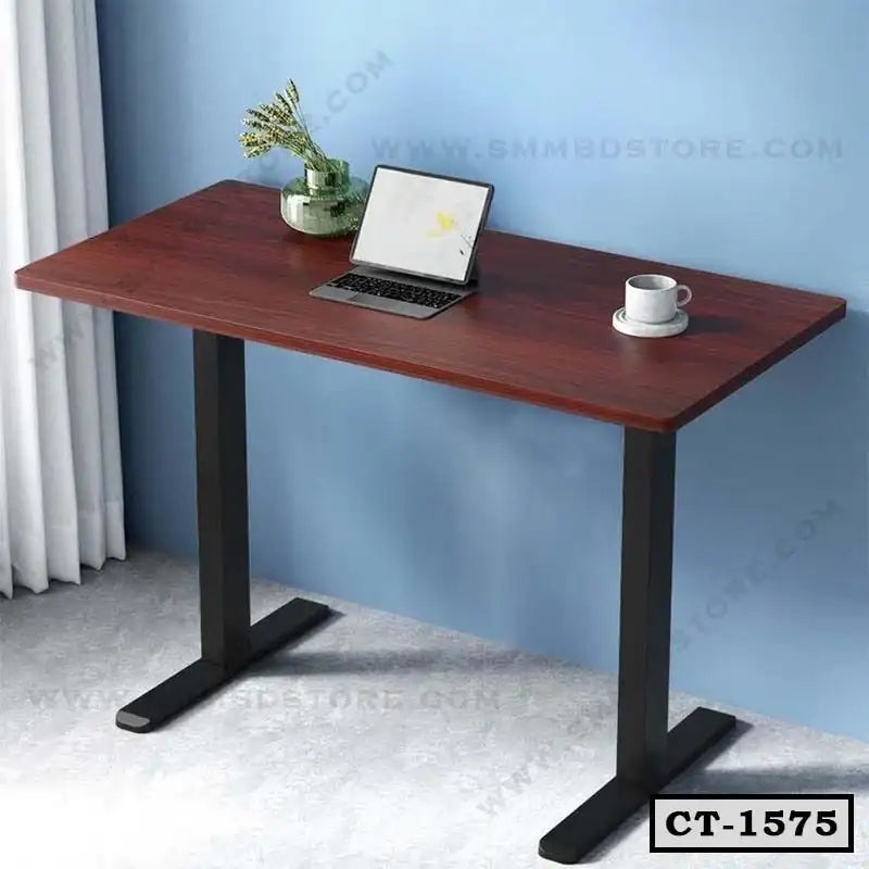 Modern wooden computer table with black metal legs, laptop, cup, and vase in home office