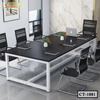 Modern black conference table with metal frame and office chairs in a meeting room