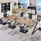 Modern conference table with mesh chairs in a bright office with city view
