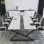 Modern conference table with black chairs in a stylish meeting room setting