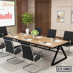 Modern conference table with black chairs in office meeting room setting