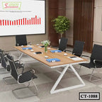 Modern conference table with chairs, documents, and plants in a professional meeting room