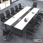 Modern conference table with twelve black mesh office chairs in a corporate meeting room