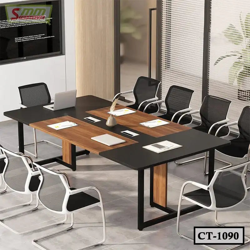 Modern conference table with black and wood finish, surrounded by mesh office chairs in meeting room