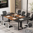 Modern office conference table with black and wood finish, mesh chairs, and office supplies