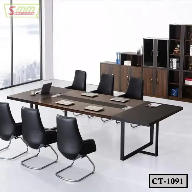 Modern conference table with six black chairs, laptops, and office cabinets in meeting room Main image