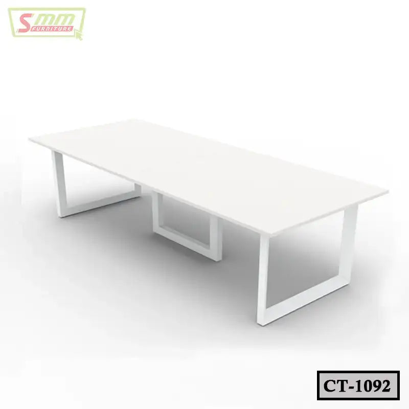 Modern white rectangular conference table with metal legs in a minimal office setting