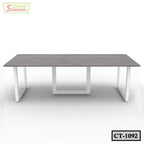 Modern rectangular conference table with white metal legs and wooden tabletop