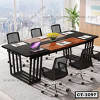 Modern rectangular conference table with black mesh chairs in a bright office setting