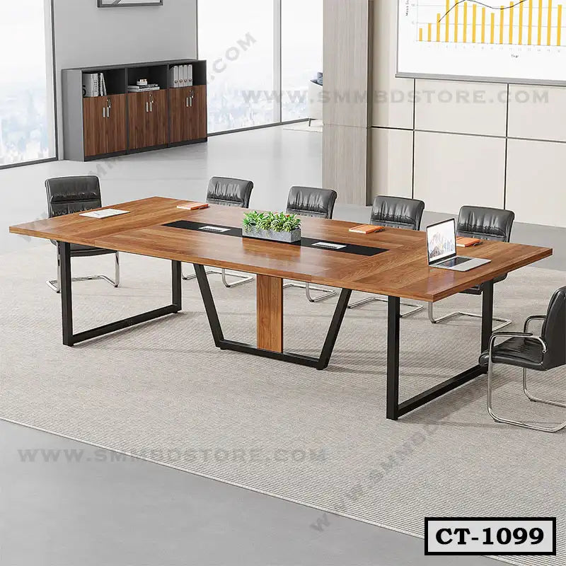 Modern wooden conference table with black metal legs, surrounded by office chairs in a meeting room Main image