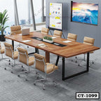 Modern wooden conference table with tan office chairs in a corporate meeting room