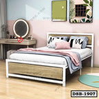 Modern double steel bed with wood panels in stylish bedroom, pillows and blankets arranged neatly.