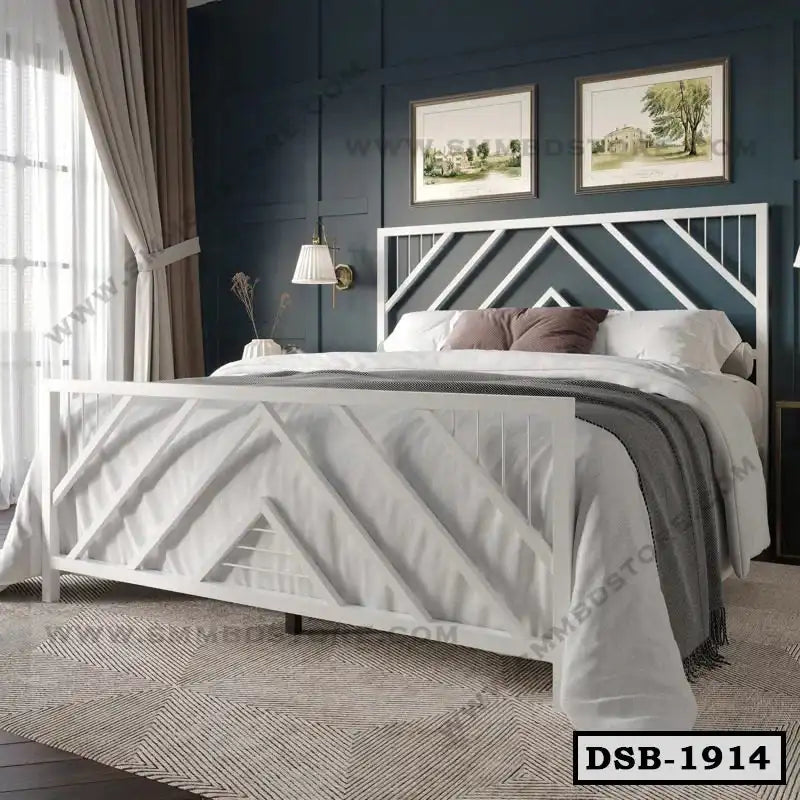 Modern white steel double bed with geometric design, cozy bedding, in a stylish bedroom