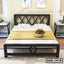 Modern double steel bed with geometric frame, pillows, and bedside tables in a bedroom