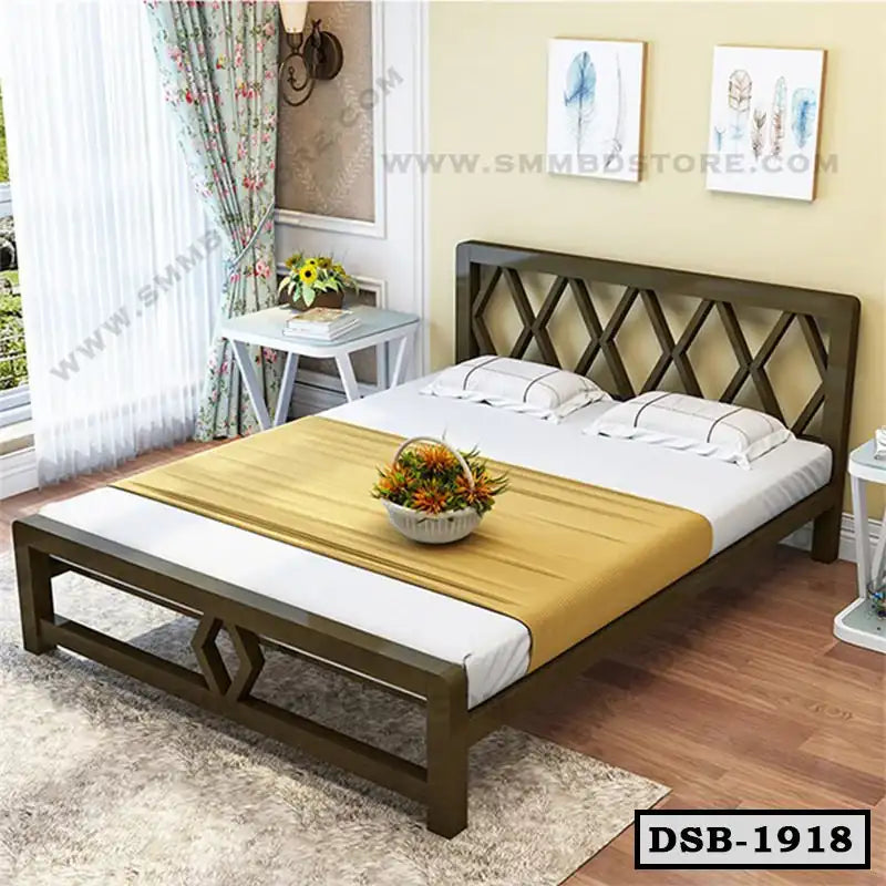 Modern double steel bed with lattice headboard, white bedding, and decorative yellow throw in a cozy bedroom.