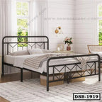 Modern double steel bed frame in a bright bedroom with light decor and large windows