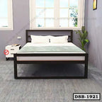 Modern double steel bed with headboard, white bedding, and side table in a minimalist bedroom