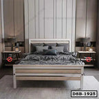 Modern double steel bed with geometric bedding, bedside tables, lamps, and a stylish gray interior.