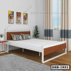 Modern double steel bed with wood accents in a bright bedroom with decor and curtains