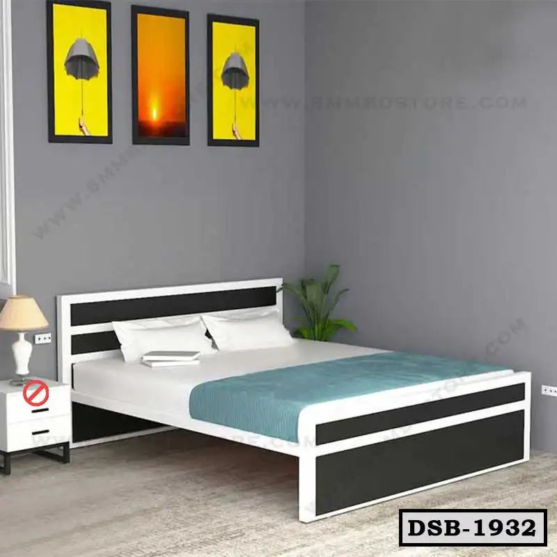 Modern double steel bed with black and white frame, teal blanket, and bedside table in bedroom Main image