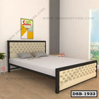 Modern double steel bed with tufted upholstered headboard in a bright bedroom