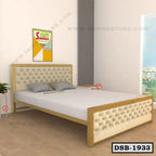 Modern double steel bed with upholstered headboard and footboard in a bright bedroom