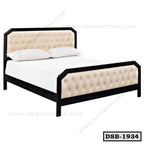 Modern double steel bed with padded beige headboard and footboard, minimalist design