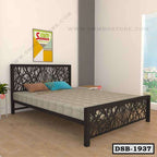 Modern double steel bed with abstract headboard design in a bright bedroom with wooden floor