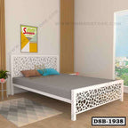 Modern double steel bed with geometric headboard and footboard in a bright bedroom