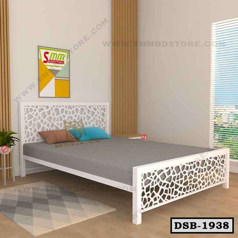 Modern double steel bed with geometric headboard and footboard in a bright bedroom