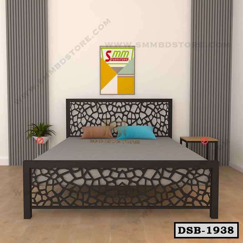 Modern double steel bed with decorative geometric headboard in a minimal bedroom