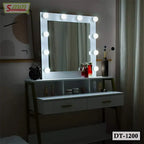 Modern dressing table with illuminated vanity mirror, makeup storage, and decor items in a bedroom