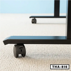 Close-up of black electric folding desk legs with caster wheels on light carpet