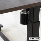 Close-up of electric folding desk motor and black metal frame, modern office furniture
