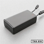 Black electric folding desk power adapter with connected cables, model THA-816, on gray surface.