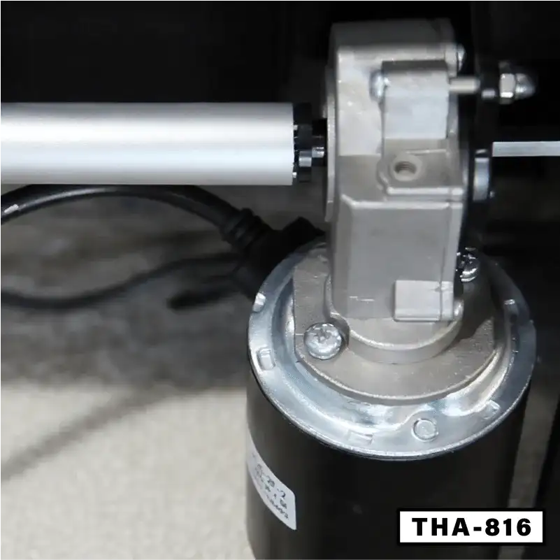 Close-up of electric folding desk motor and metal mechanism with THA-816 label