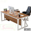 Modern executive office table with wooden top, white metal frame, computer and office chair