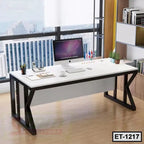 Modern executive office table with computer, decor, and city view through large windows