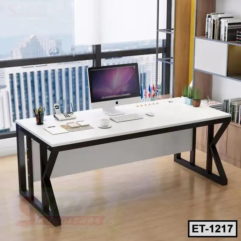 Modern executive office table with computer, decor, and city view through large windows