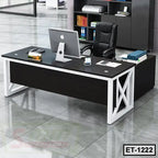 Modern executive office table with black surface, white metal frame, office chair and computer