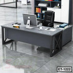 Modern executive office table with black chair and computer in a contemporary office setting