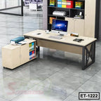 Modern executive office table with metal frame, storage cabinet, computer, and organized workspace