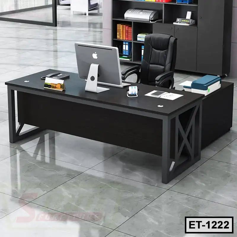 Modern executive office table with black finish and computer setup in a contemporary workspace