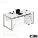 Modern executive office table with metal legs, laptop, books, and mobile drawers on white background