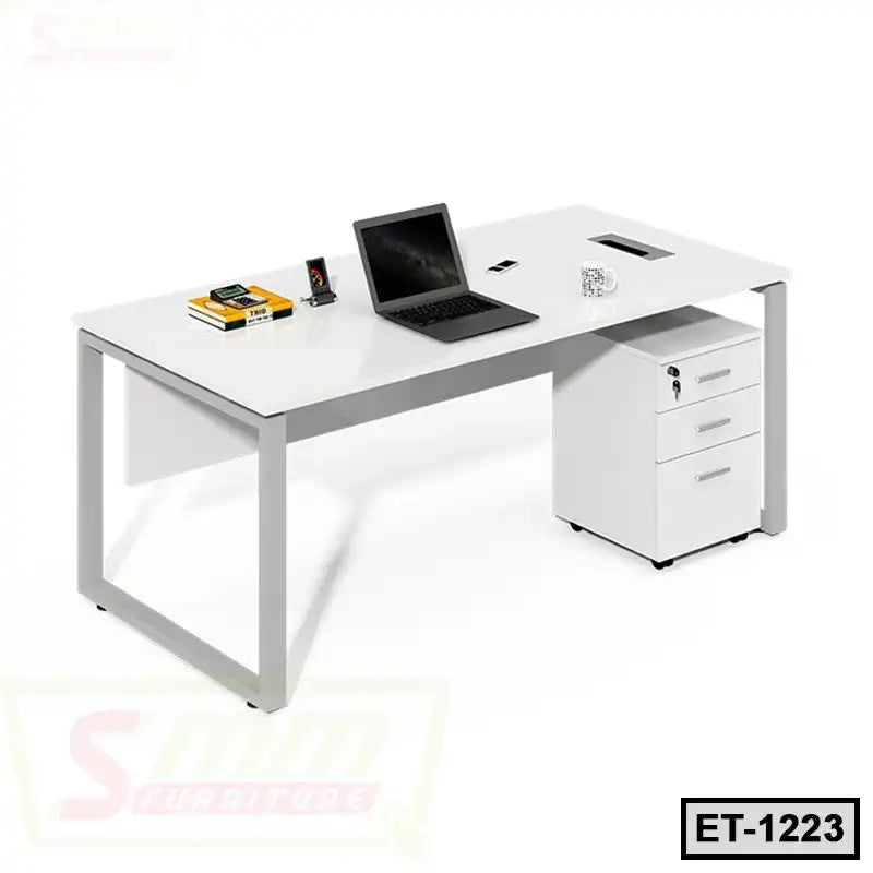 Modern executive office table with metal legs, laptop, books, and mobile drawers on white background