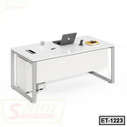 Modern white executive office table with metal frame, laptop, and desk accessories