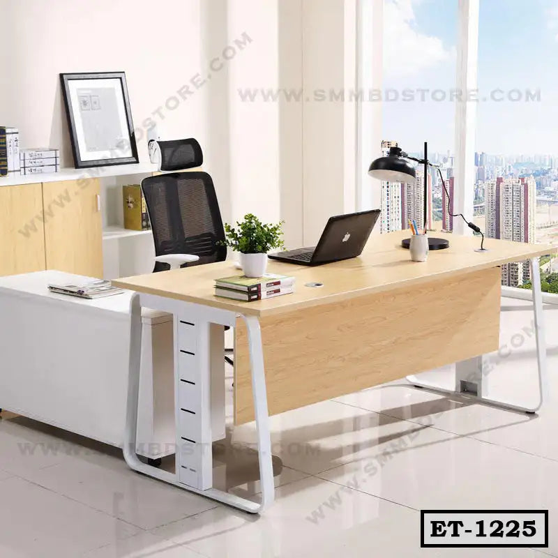 Modern executive office table with light wood finish, metal legs, and black mesh chair in bright room