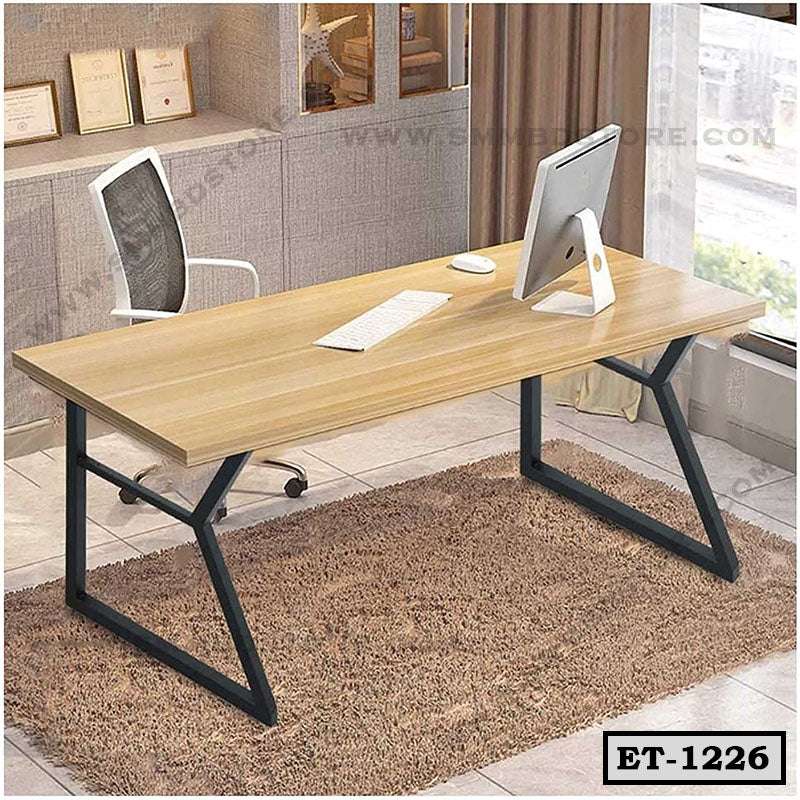 Modern executive office desk with wooden top and metal legs, computer and chair on carpet Main image