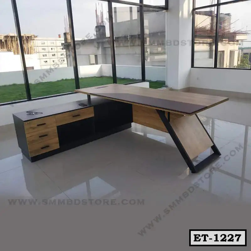 Modern executive office table with drawers and shelves in a bright workspace